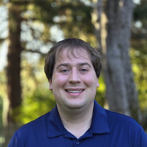 Steven Storie — outdoor headshot in a navy polo
